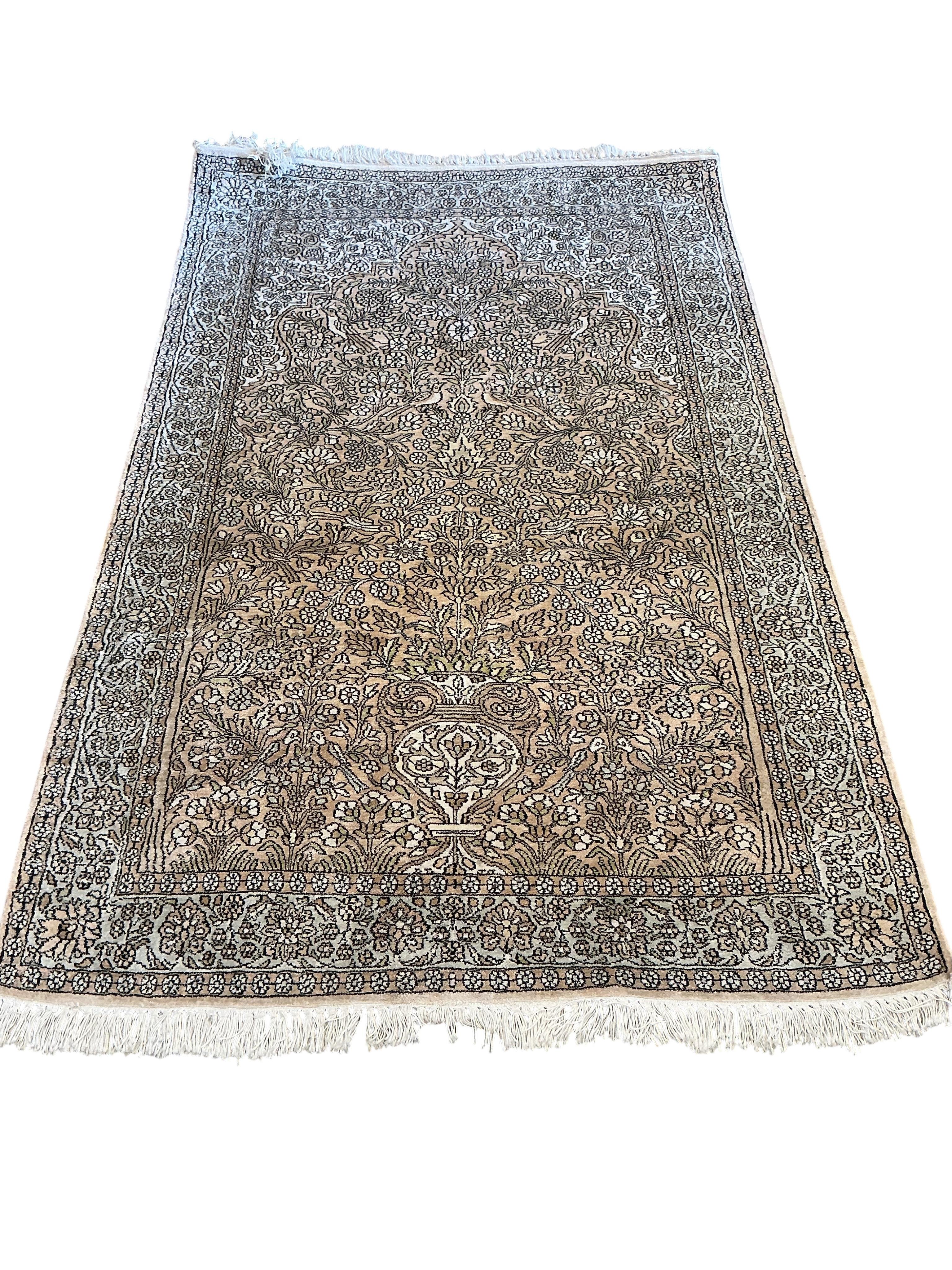 A North West Persian faded red ground rug, 191 x 120cm